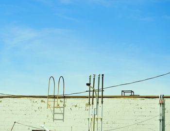 Low angle view of built structure against blue sky