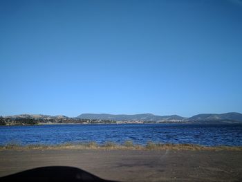 Scenic view of sea against clear blue sky