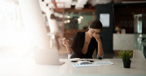 Exhausted businesswoman at office