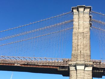 Low angle view of tower against clear blue sky