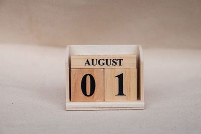 Close-up of information sign on table