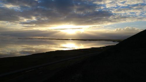 Scenic view of road against dramatic sky