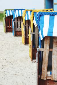 Clothes drying on beach against sky
