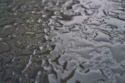 Full frame shot of raindrops on snow