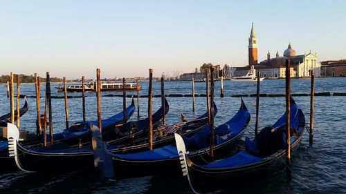 Boats moored at dock