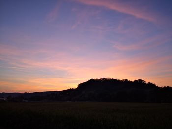 Scenic view of silhouette landscape against sky during sunset