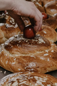 Cropped hand of person preparing food