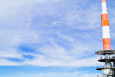 Low angle view of communication tower against sky