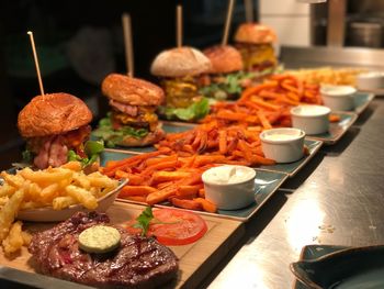 Burgers in tray on table