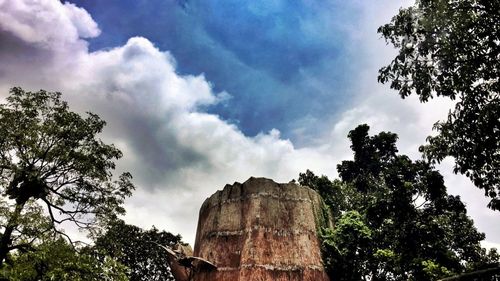 Low angle view of rocks against sky