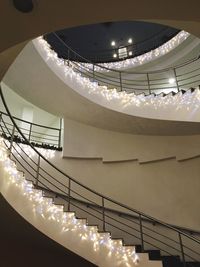 Low angle view of illuminated chandelier in building