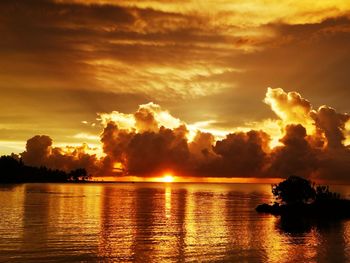 Scenic view of lake against sky during sunset