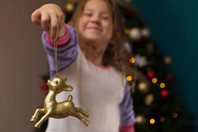 Close-up of girl holding toy