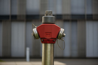 Close-up of telephone booth against wall