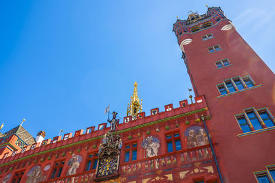 Low angle view of buildings against blue sky