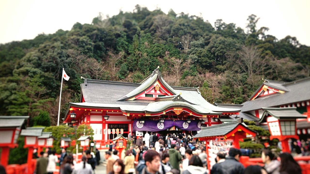 large group of people, architecture, tree, person, built structure, religion, lifestyles, building exterior, men, place of worship, leisure activity, temple - building, crowd, tradition, spirituality, cultures, roof, tourist, travel destinations