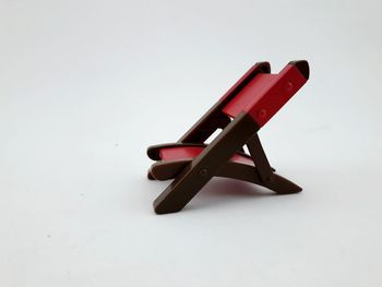 Close-up of toy over white background