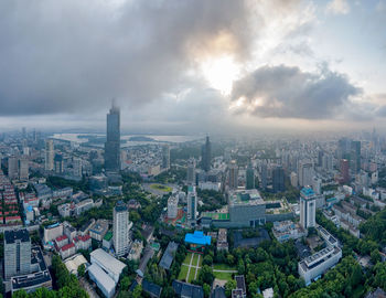 High angle view of buildings in city against sky