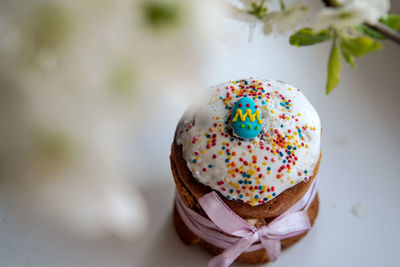 Easter composition with easter cake and blossoming tree branches