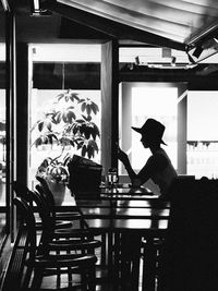 Man and woman sitting on table