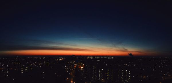 Illuminated cityscape at night