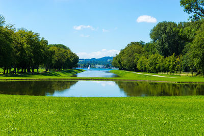 Scenic view of lake against blue sky