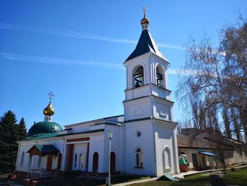 Low angle view of building against blue sky