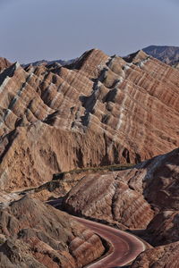 Scenic view of arid landscape against sky