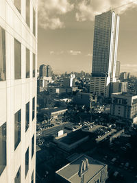 High angle view of buildings in city against sky