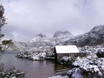 Scenic view of lake and mountains against sky