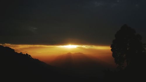 Scenic view of silhouette landscape against sky during sunset