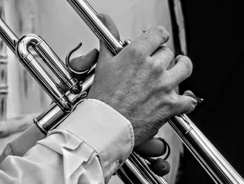 Cropped image of musician playing musical instrument