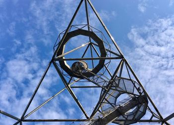 Low angle view of crane against sky