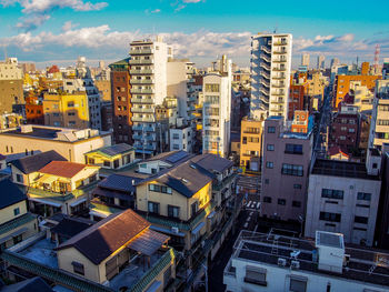 High angle view of buildings in city against sky