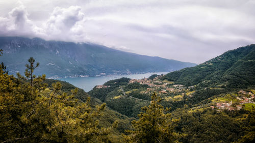 Scenic view of landscape with lake and mountains against sky