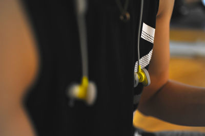 Rear view of man holding umbrella