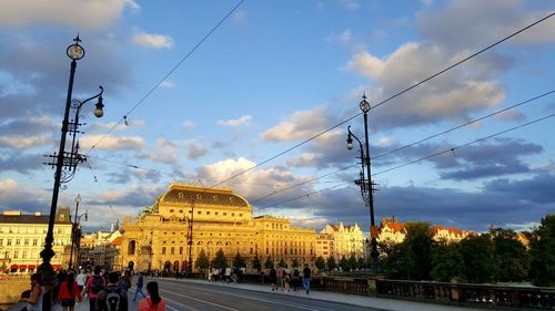 People in city against sky