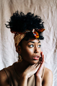 Portrait of young woman wearing hat