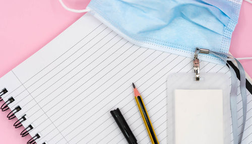 High angle view of pen and book