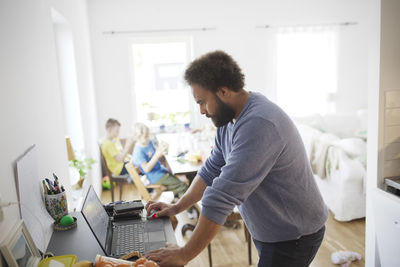 Man working on laptop from home