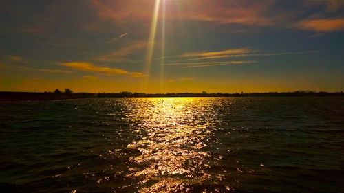 Scenic view of sea at sunset