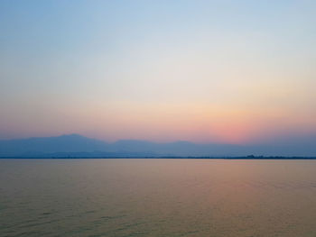 Scenic view of sea against clear sky during sunset