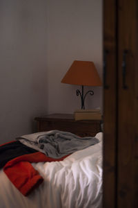 Information sign on bed against wall at home