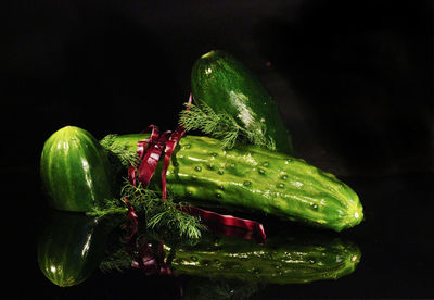 Close-up of bell peppers against black background