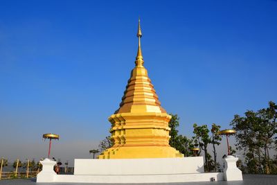 Low angle view of building against clear blue sky