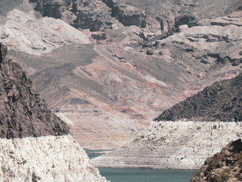 Scenic view of rocky mountain by sea