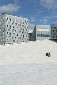 Buildings in city against sky