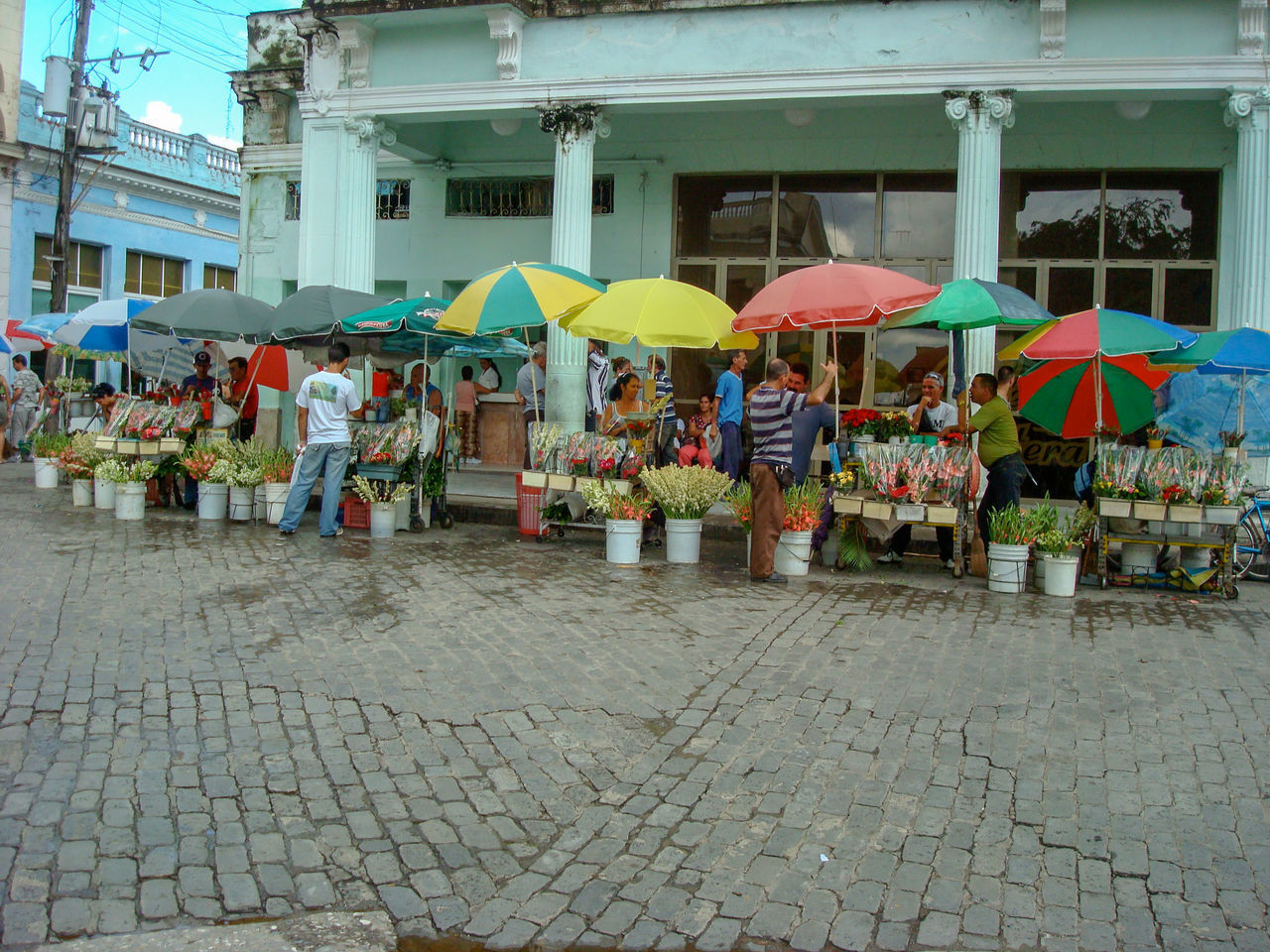 GROUP OF PEOPLE IN MARKET STALL