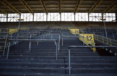 Low angle view of empty soccer stadium