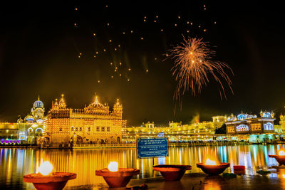 Low angle view of firework display at night